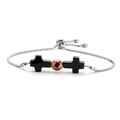 Detailed shot of adjustable stainless steel bracelet featuring black cross and iridescent bead - Blue Sandstone