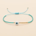 Bracciale etnico intrecciato a mano con perline occhio blu e dettagli dorati - Celeste (MI-B200498T)