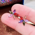 Macro view of a colorful five-petal flower stud earring with marquise-cut gems - Colorful Zirconia