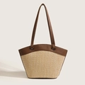 Minimalistische Strohtasche mit braunen Ledergriffen und strukturierter Weboptik - Braun