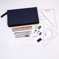 Flat lay of professional drafting set with blue pouch, compasses, pencils and rulers - Model 5023 Premium Drawing Bag Set