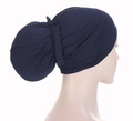 Navy blue turban cap with a large bow and hair bun space for women on a mannequin - Navy Blue