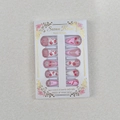 Close-up of pink press-on nails with red lips, bows and rhinestones in gift box - Pink White Lip Print Heart (WY-015)