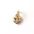 Detail of heart-shaped gold pendant with a central sparkling cubic zirconia stone - 10-Heart with Single Zircon