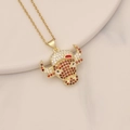 Macro shot of gold bull head pendant with red and white zircon stones on beige ceramic - Red & White Micro Pave Bull Head Style (11#)