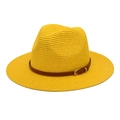 Detail of a bright yellow woven straw Fedora hat featuring a brown belt with a gold buckle - Yellow