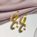 Detail of C-shaped gold-plated stainless steel earrings with white pearls on satin - 1299-Gold C-shape Pearl