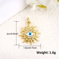 Detailed size view of a gold sun pendant with blue devil eye and white zircon inlay - Sun Evil Eye