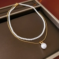 Detail of layered gold beaded chain with elegant faux pearls on a brown tray - 4mm Pearl Double Layer Necklace 2pcs Set