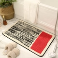 Tappeto da bagno in peluche a strisce geometriche bianche e nere con un blocco rosso vivace - 40x60cm / Rosso