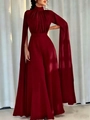 Deep red pleated jumpsuit featuring dramatic floor-length cape sleeves and high neck detail - S / Burgundy