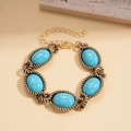 Detail of vintage gold-tone bracelet with oval blue stones and twisted rope metal edges - Bracelet / Blue