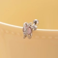 Saturn shaped titanium steel stud earring with pink zircon stone on ceramic background - Single/Screw Ball Style (A121-2#) / Pink