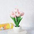Detail of pink LED tulip night light in white ceramic pot with realistic green leaves - 5 Heads-Pink-Battery