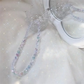 Macro shot of colorful iridescent heart-shaped acrylic beaded phone charm on a crystal stand - White Heart