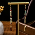 Detail of long drop earrings featuring bamboo-shaped stones and colorful beaded tassels - Multi-color Stone Cylinder Beaded (E1725-2)