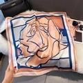 Close-up of silk scarf with pink rose print on white plush rug beside a black handbag - 70*70cm / Pink Base Large Rose