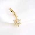 Detail of gold starburst hoop earring featuring a center opal and paved zircon stones - Single Gold - Style A (Octagram)