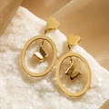 Pendientes de mariposa dorados con aros ovalados y tachuelas de corazón en piedra blanca - Estilo Ovalado Corazón Mariposa