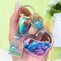 Pink heart liquid glitter keychain with holographic wrist strap and gold lobster clasp - Colorful
