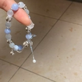 Beaded bracelet with blue and amber beads, silver whale tail charm, and pearl tassel - White-Blue-Whale Tail