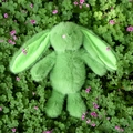 Plush long-eared rabbit doll in light green soft fur sitting in clover field - 25cm / Green
