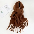 Deep brown knitted scarf with long tassels and thick texture on a clean background - Brown