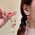 Detail of floral butterfly tassel earrings with colorful beads and white petals on model - 6# Colorful Flower Beaded Tassel (Silver Pin)