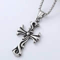 Close-up of silver titanium steel cross pendant necklace with gothic floral engraving - Scroll Pattern Cross Pendant