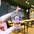 Detail of miniature bubble tea keychain with pink octopus inside liquid and glitter - Pink Octopus [Milk Tea Cup]