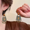 Close-up of Bohemian earrings with bronze openwork and colorful beads in retro style - 9# Ear Hook - Gold - Green