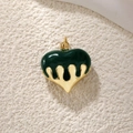 Macro shot of green heart pendant with dripping gold finish for DIY jewelry designs - Dark Green Enamel Drip Heart Pendant