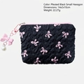 Black ruched cosmetic pouch with pink bow prints and a decorative pearl charm - Black & Pink Bowknot Mini Hexagon Bag