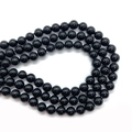 Macro shot of polished black round imitation pearl beads for DIY jewelry making - 6mm / Black