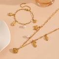Detail of gold ocean-themed stainless steel necklace and bracelet with marine pendants - Clownfish Beach Jewelry Set (T704-T707)