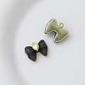 Detailed front and back view of a black bow pendant with a gold heart for DIY jewelry - Style 27