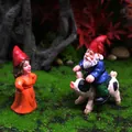 Garden gnome duo with a female in red and a male riding a spotted pig on moss - 2-Piece Gnome Set (Male Riding Pig + Standing Female)