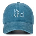 Close-up of Be Kind embroidery and heart pattern on blue washed denim baseball cap - Lake Blue