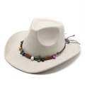 Cream suede cowboy hat with ethnic beaded band and braided rope on white background - Suede / Off White