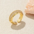 Macro shot of gold-plated S925 ring featuring triple rows of sparkling micro-pave zircons - Adjustable Open / Gold Triple Row Zirconia