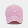 Close-up of pink baseball cap with white heart embroidery on premium cotton twill fabric - Adjustable / Pink