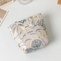 Detail view of the floral jacquard fabric texture and zipper on this off-white makeup bag - Blue Hydrangea Jacquard (Small)