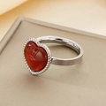 Close-up of heart-shaped red stone ring with silver braided rope border detail - US 6 / Steel Color Heart With Red Pine Stone (KR108062-GC)