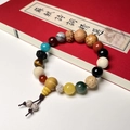 Detail of multi-gemstone prayer beads resting on a red book cover with white background - 1st Gen Premium - Lingyin Style