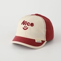 Close-up of red and beige patchwork baby baseball cap with Nice smile embroidery - 50cm (1-3 Years) / Beige/Red Color Block
