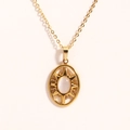 Detailed shot of a 14K gold-plated necklace featuring a white opal sunburst oval pendant - Oval White Cat Eye Sun (Style 5)