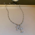 Silver cross necklace with sparkling rhinestones on a minimalist jewelry tray display - Silver Rhinestone Double Cross Necklace