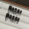 Handmade cyberpunk cat-eye press-on nails with black gradient and silver bow charms - Extra Small (XS)