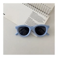 Close-up of light blue kids polarized sunglasses placed on a minimalist white notebook - Light Blue