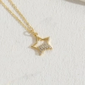 Luxury gold star pendant necklace with cubic zirconia pave and thin cross chain - Gold Semi-Hollow Star